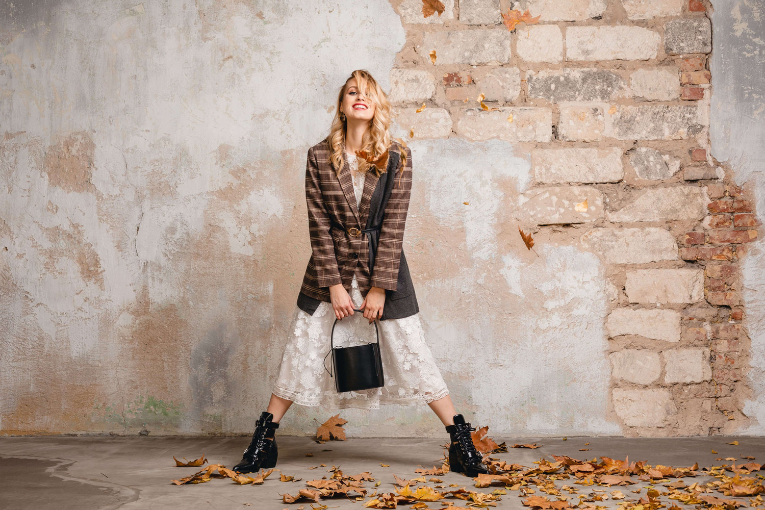 attractive-stylish-smiling-blonde-woman-checkered-jacket-walking-against-wall-street-min (1).jpg__PID:cbc791a7-a41f-48a4-aef0-09e03fa580ba